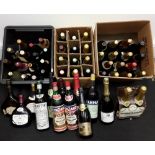 A large collection in excess of 50 miscellaneous unopened vintage bottles of wines and spirits.