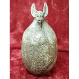 A reproduction Egyptian canopic jar in the form of Anubis.