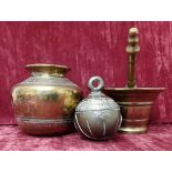 An Islamic style bell, a brass pestle and mortar and a brass jardiniere.