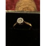 An 18ct gold solitaire diamond ring in illusion setting.