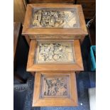 A nest of three mahogany tables.