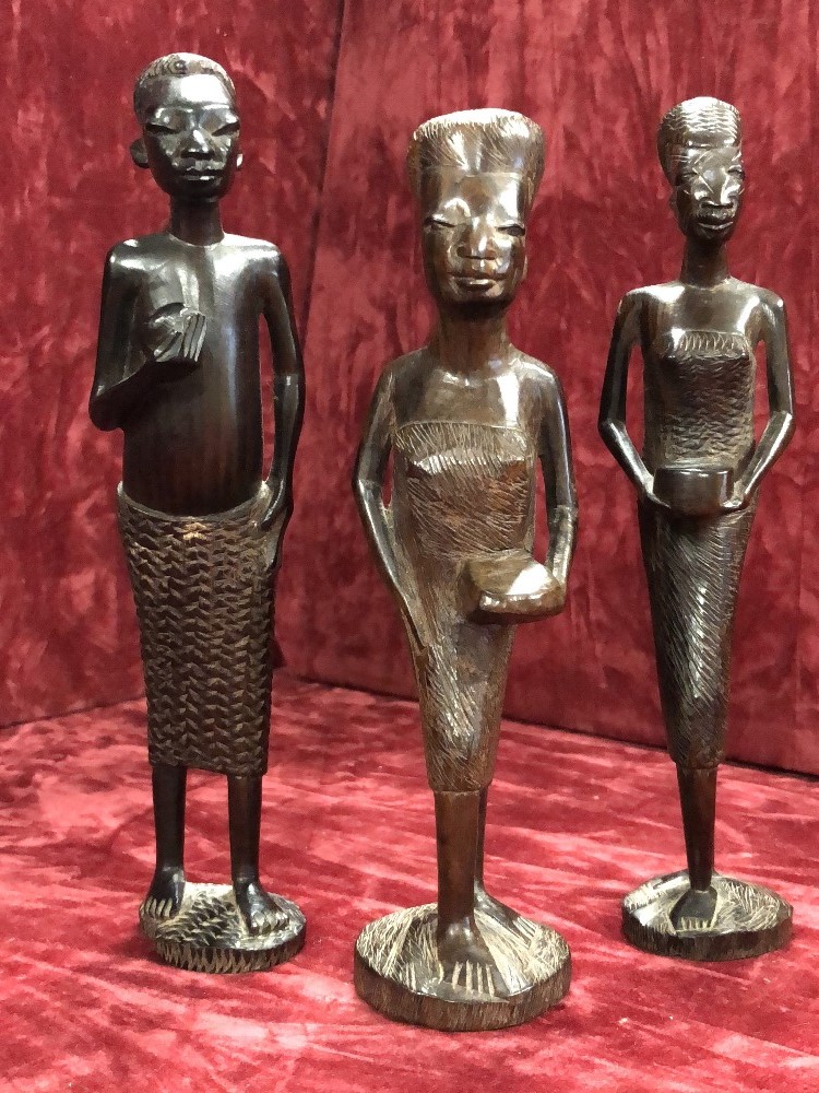 A group of three African carved wooden tribal figures