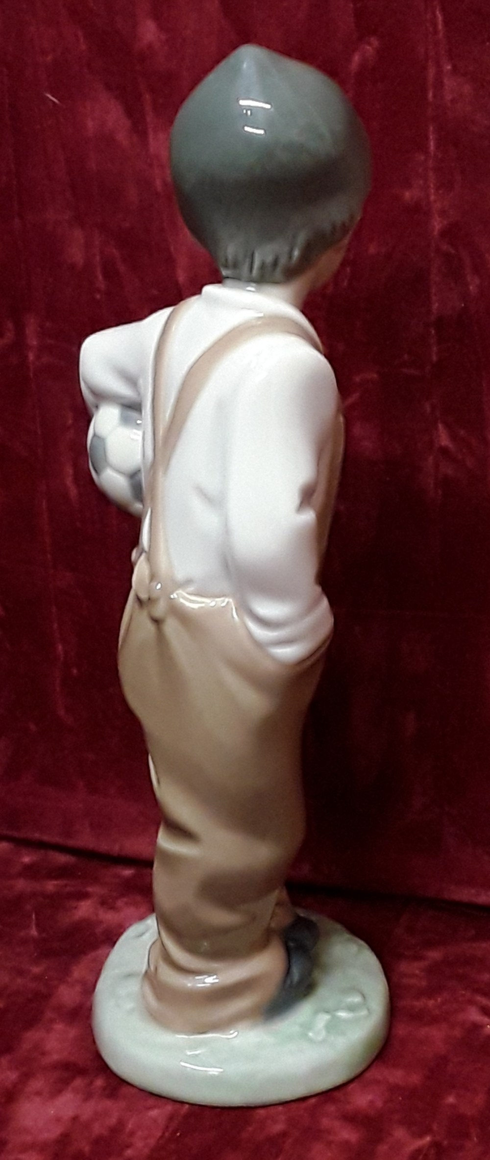 A Lladro Nao Daisa 1988 figurine of boy with a football. - Image 4 of 4
