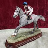 A Border Fine Arts sculpture of a jockey on a horse, titled ‘Down to the start - Grey'.