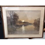 A large framed watercolour painting of the sun setting over water. Signed by artist.