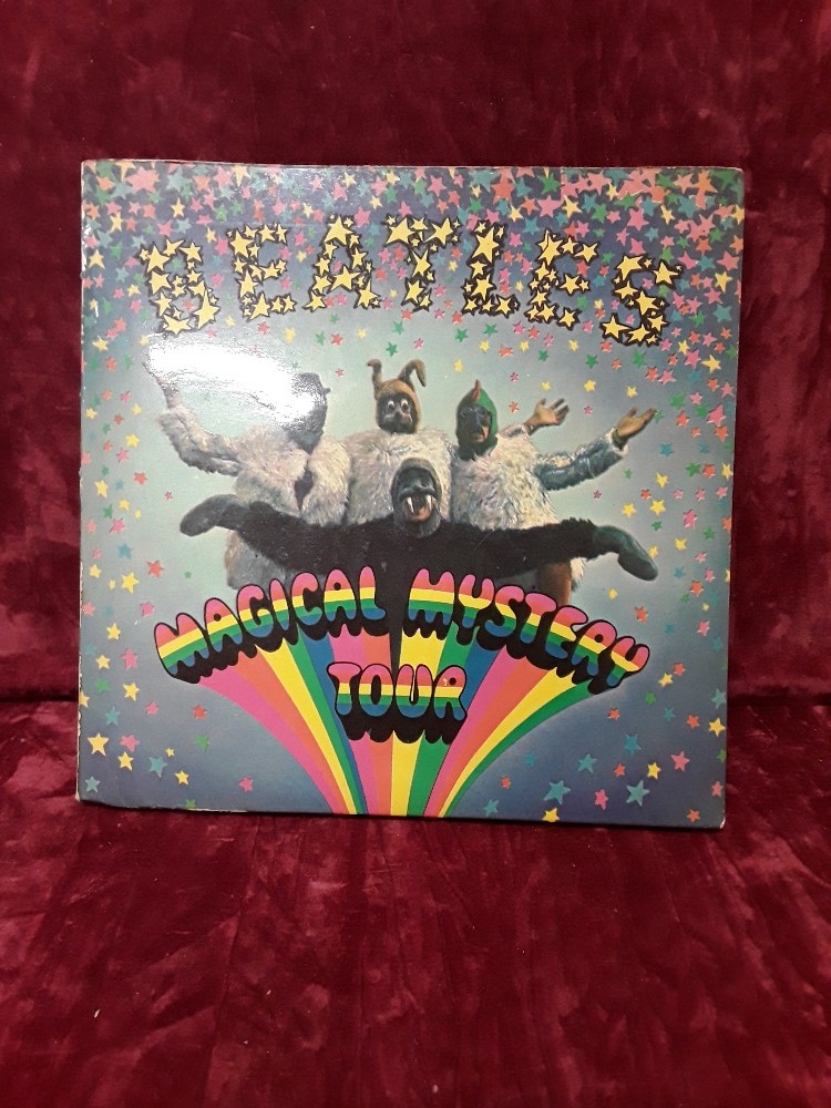 A "Beatles Magical Mystery Tour" Vinyl 33 ½ EP complete with EP book.