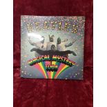 A "Beatles Magical Mystery Tour" Vinyl 33 ½ EP complete with EP book.