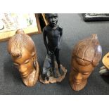 An assortment of carved wooden African animals and figures.