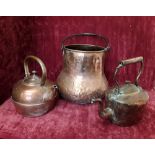 Three pieces of bargeware to include two copper kettles and a large copper pot.