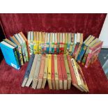 A large collection of Enid Blyton books from the 1960s and 1970s.