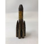 A piece of WW2 trench art made from an inert cannon shell and seven inert rifle bullets.
