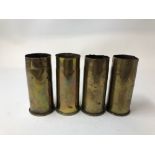 Three Imperial German brass shell cases dated 1916 together with another dated 1883.