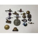 An assortment of 18 WW1 and WW2 sweetheart brooches and lapel badges plus converted cap badges etc.