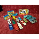 An assortment of die-cast cars and other vehicles including Dinky, Corgi and Matchbox.