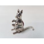 A silver pincushion in the form of a kangaroo.