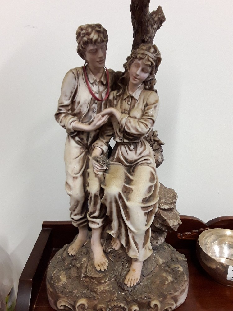 A Contemporary Academy Collection figurine sculpture of couple sitting beneath a clock. - Image 2 of 3