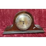 An Art Deco mantel clock with the name Poreigh.