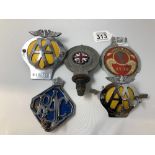 An assortment of car badges including two for the AA, two for the RAC and one for the BCSF.