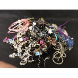 A large box of costume jewellery.