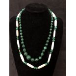 A necklace of graduated malachite beads together with a malachite and bone necklace.