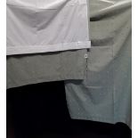A pair of fully lined polyester/cotton mix green curtains.