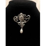 An Art Nouveau style silver brooch.