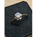 A 9ct yellow gold solitaire ring set with large CZ.