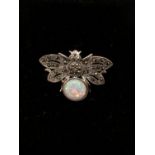 A silver and marcasite bee brooch with opalite body.