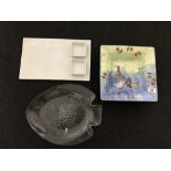 Three serving dishes including a glass fish and Italian ceramica plus a soapstone dish.