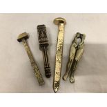 Two sets of brass nutcrackers plus a brass half foot rule and a small brass hammer.