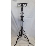 A blackened metalwork church candle or flower stand.