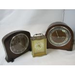 A selection of three mantel clocks.