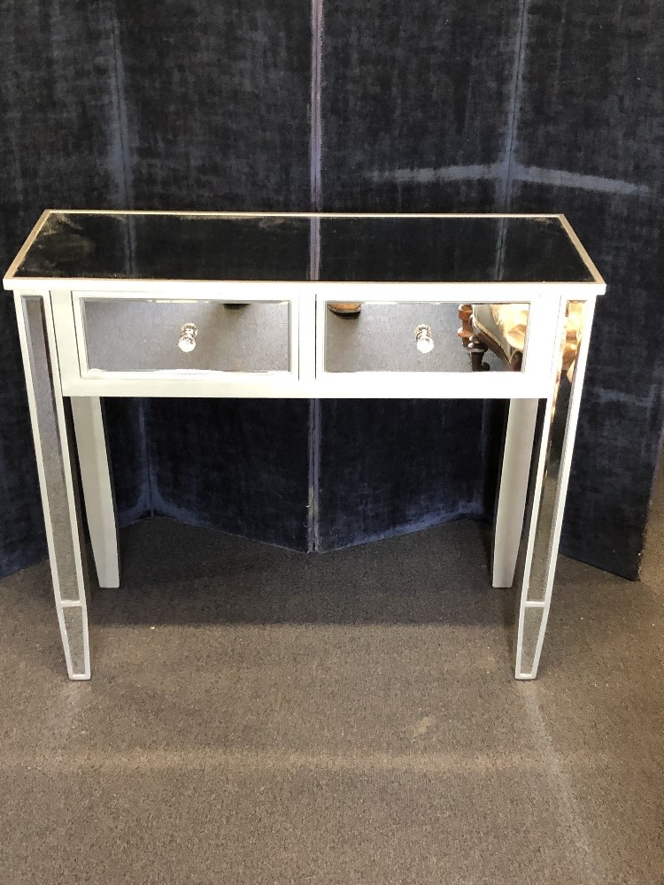 A contemporary glass topped side table.