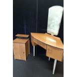 A set of retro bedroom furniture of small proportions.