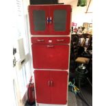 A red and white retro 1950s kitchen cabinet.