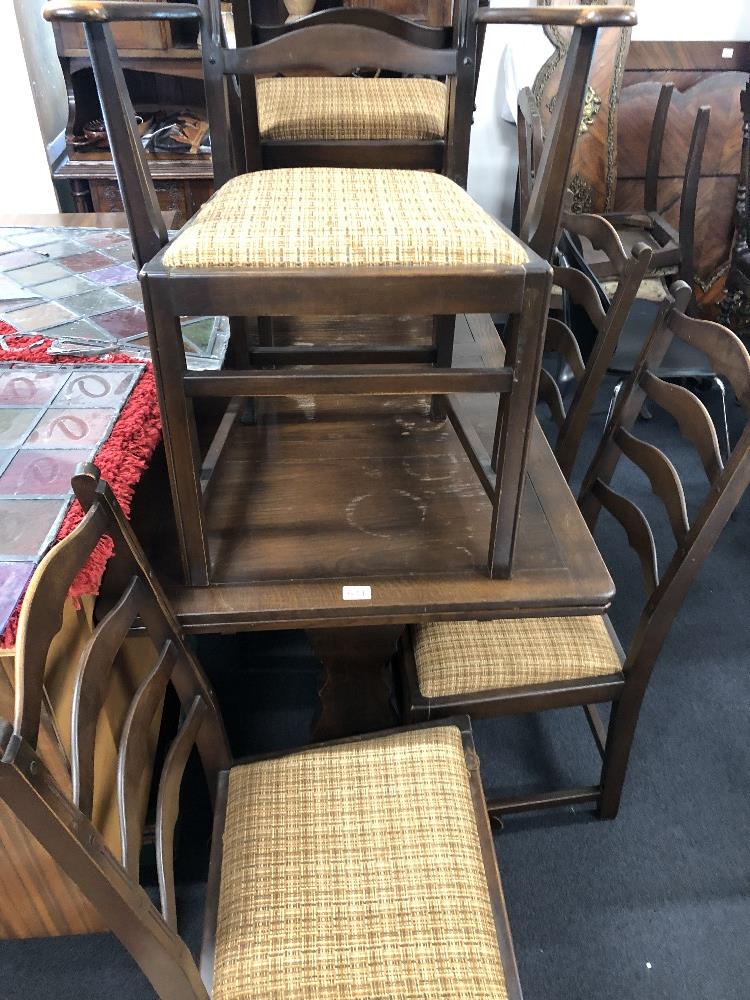 A small oak Art Deco style Ercol extending dining room table with six chairs. - Image 2 of 4