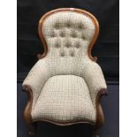 A late 19th Century nursing chair with button back. Re-upholstered.