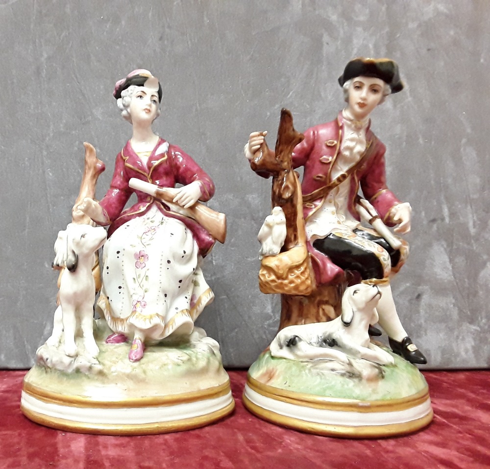 A pair of continental hard paste porcelain figurines.