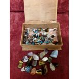 A box of tumbled stones including tiger's eye, amethyst, rose quartz and turquoise.