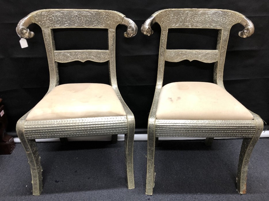 A pair of silver wrapped Anglo-Indian Regency style wedding chairs.