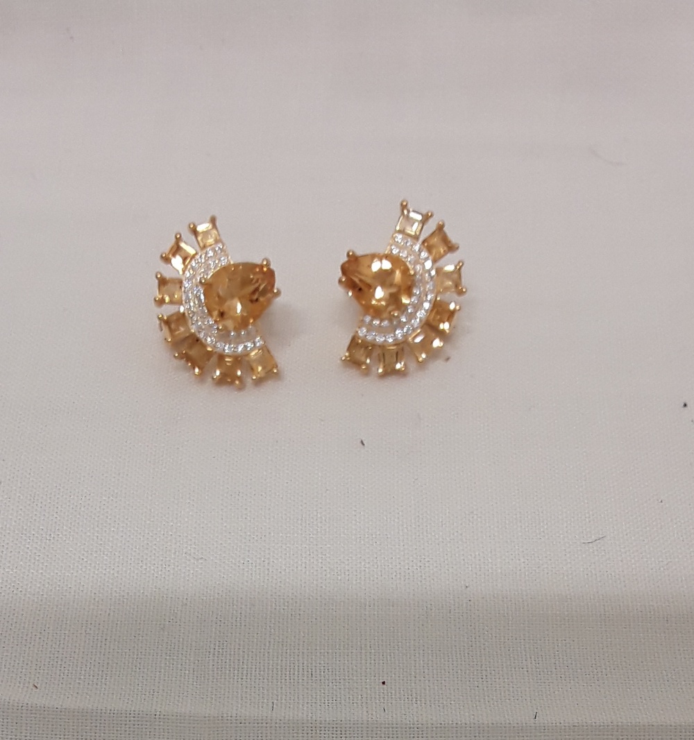 A pair of Art Deco style silver earrings set with citrine.