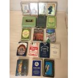 A set of 15 vintage boxed packs of playing cards, some unused, some double decks.