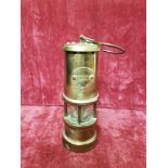 A small brass miner's paraffin lamp by the Lamp and Lamplight Company Hockley.