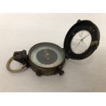 A 1917 military compass with the crow's foot stamped to the back