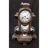 An Sevres ormolu clock with hand painted porcelain panels.