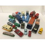 A box of assorted playworn vintage die-cast toys including Dinky.