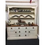 A contemporary cherry wood topped welsh dresser of large proportions.