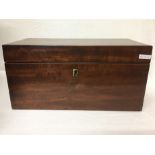 An antique mahogany tea box with three compartments.