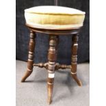 A Regency style mahogany stool of circular form with revolving seat.