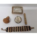 A box of mother of pearl counters together with a mix of ivory and horn carved items.